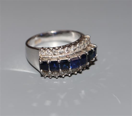 A modern 18k white metal and three row sapphire and diamond set dress ring, size O, gross weight 6.5 grams.